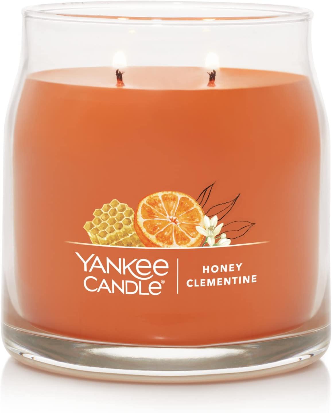 imageYankee Candle Studio Scented Candle with up to 50 Hour Burn Time Premium Plant Wax Blend for Consistent Burn 10 oz Jar Candle with Room Filling Fragrance Iced Berry LemonadeHoney Clementine
