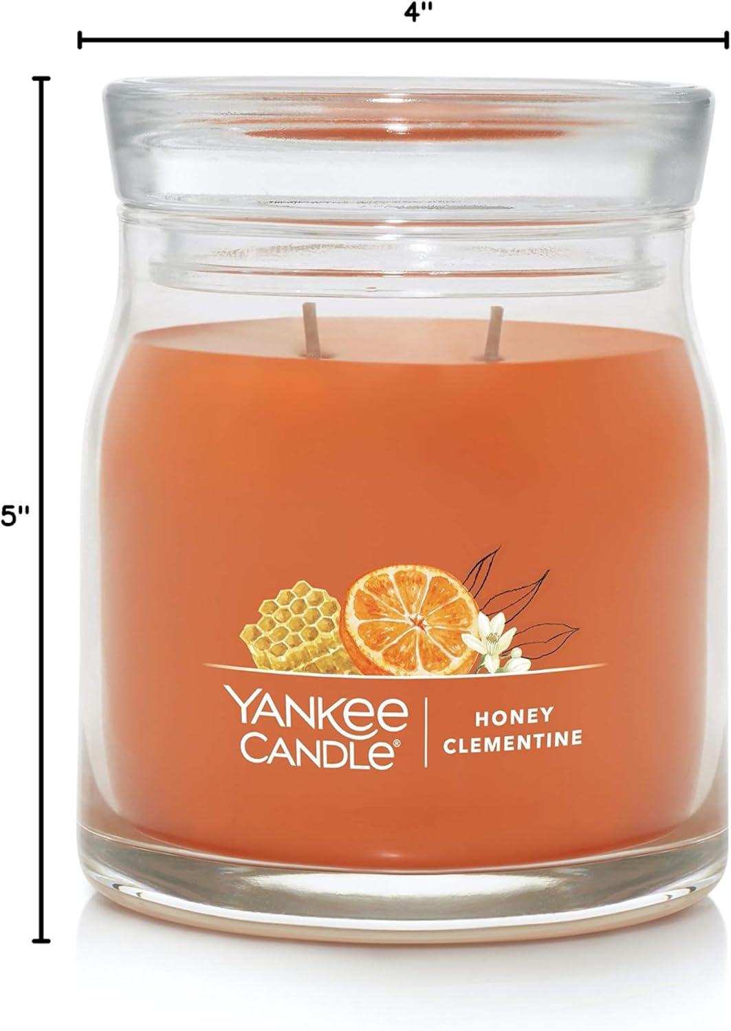 imageYankee Candle Studio Scented Candle with up to 50 Hour Burn Time Premium Plant Wax Blend for Consistent Burn 10 oz Jar Candle with Room Filling Fragrance Iced Berry LemonadeHoney Clementine