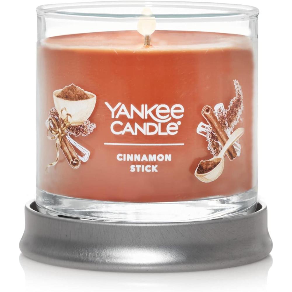 imageYankee Candle Medium Pillar Scented Candle with up to 115 Hour Burn Time Premium Plant Wax Blend for Consistent Burn 1425 oz Pillar Candle with Room Filling Fragrance Pumpkin Banana SconeCinnamon Stick