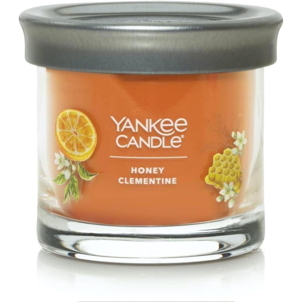 imageYankee Candle Medium Pillar Scented Candle with up to 115 Hour Burn Time Premium Plant Wax Blend for Consistent Burn 1425 oz Pillar Candle with Room Filling Fragrance Pink SandsHoney Clementine