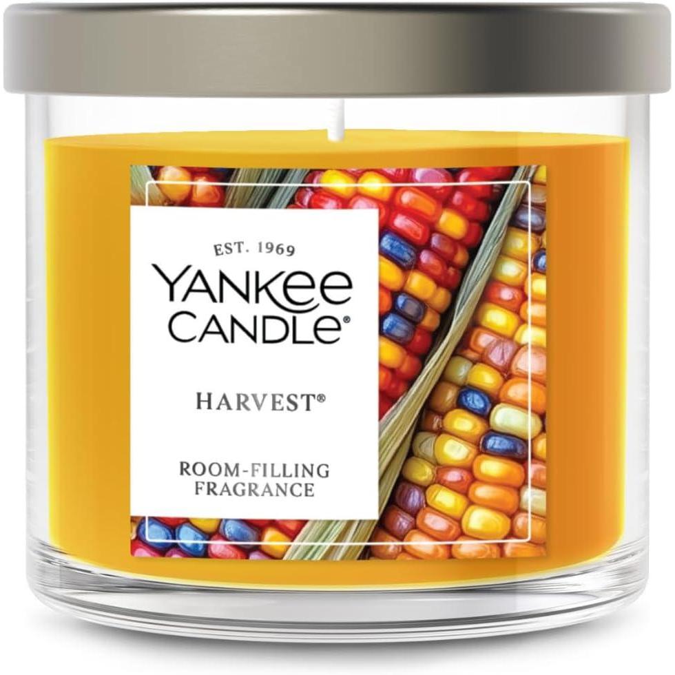 imageYankee Candle Medium Pillar Scented Candle with up to 115 Hour Burn Time Premium Plant Wax Blend for Consistent Burn 1425 oz Pillar Candle with Room Filling Fragrance Pumpkin Banana SconeHarvest
