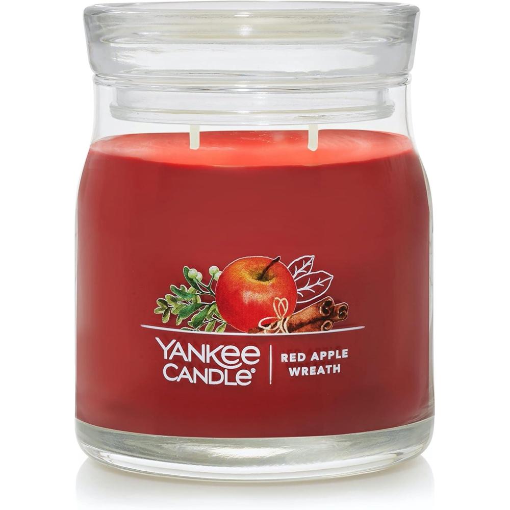 imageYankee Candle Studio Scented Candle with up to 50 Hour Burn Time Premium Plant Wax Blend for Consistent Burn 10 oz Jar Candle with Room Filling Fragrance Spiced PumpkinRed Apple Wreath