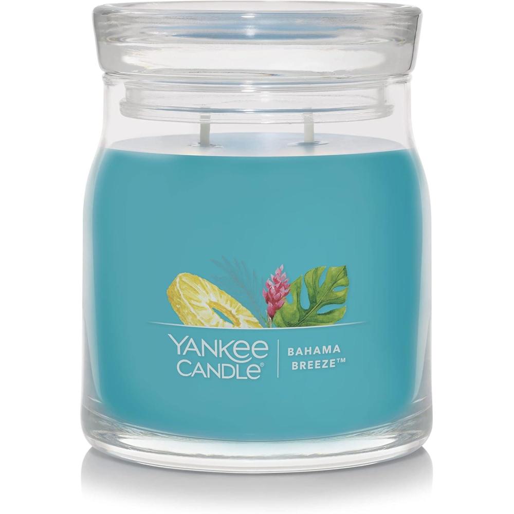 imageYankee Candle Studio Scented Candle with up to 50 Hour Burn Time Premium Plant Wax Blend for Consistent Burn 10 oz Jar Candle with Room Filling Fragrance Iced Berry LemonadeBahama Breeze
