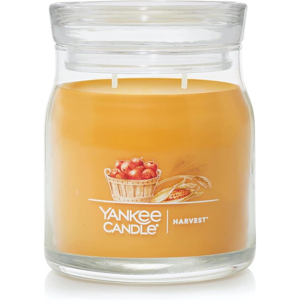 imageYankee Candle Studio Scented Candle with up to 50 Hour Burn Time Premium Plant Wax Blend for Consistent Burn 10 oz Jar Candle with Room Filling Fragrance Spiced PumpkinHarvest