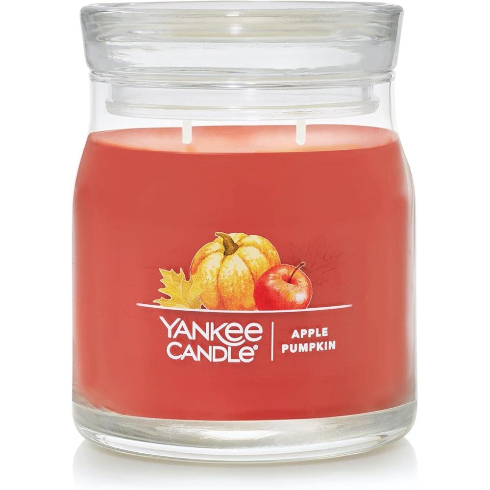 imageYankee Candle Studio Scented Candle with up to 50 Hour Burn Time Premium Plant Wax Blend for Consistent Burn 10 oz Jar Candle with Room Filling Fragrance Spiced PumpkinApple Pumpkin