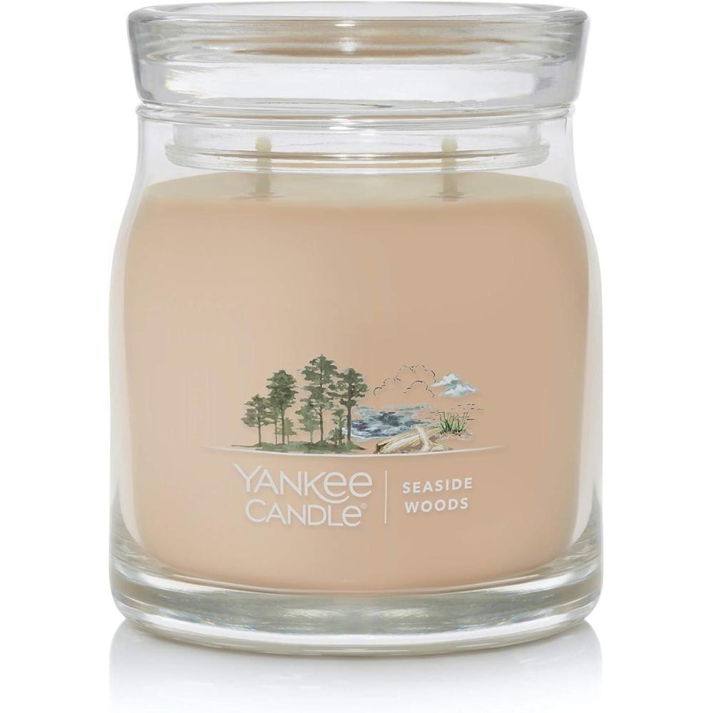 imageYankee Candle Studio Scented Candle with up to 50 Hour Burn Time Premium Plant Wax Blend for Consistent Burn 10 oz Jar Candle with Room Filling Fragrance Iced Berry LemonadeSeaside Woods
